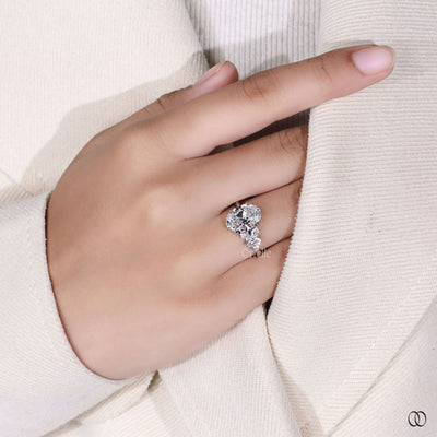 oval cut diamond ring round marquise side stones
