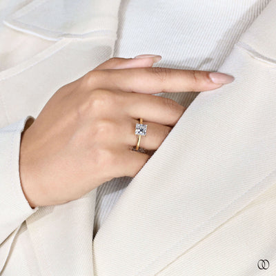 Hidden halo engagement ring beneath princess cut diamond
