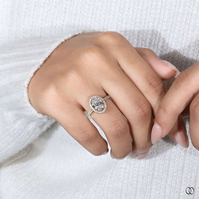 Pave diamond ring paired with oval engagement ring
