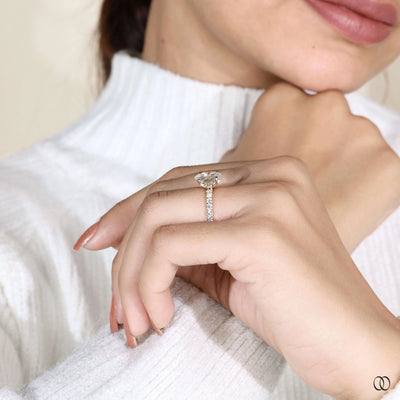 Tulip shank ring supporting oval diamond engagement ring
