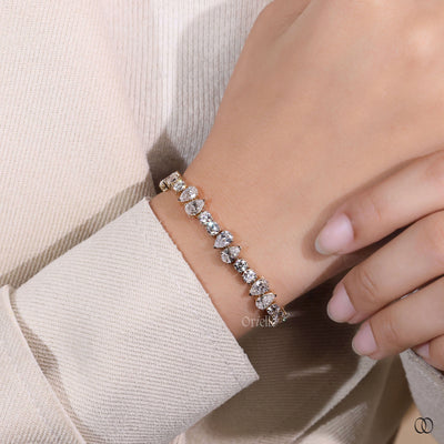 pear round cut diamond bracelet yellow gold design
