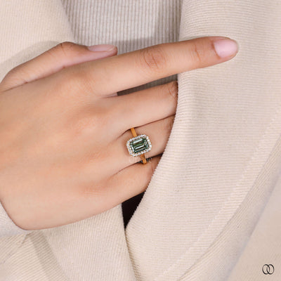 emerald diamond ring yellow gold halo setting
