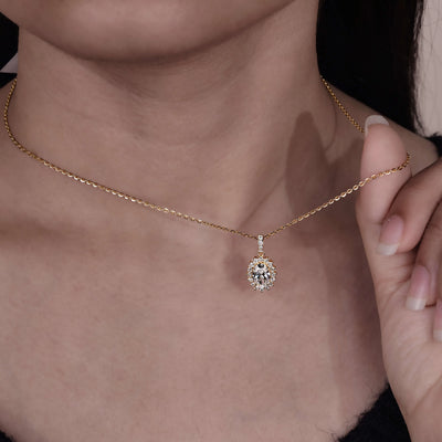Oval diamond pendant with a sparkling halo and delicate detailing
