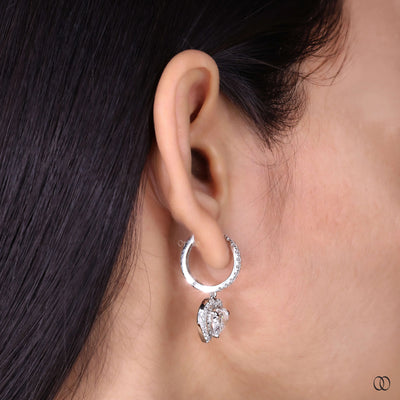 Heart drop earrings with sparkling pavé diamond halo details
