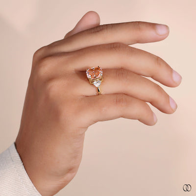 Orange Cushion Cut Ring With Side Trillion Stone