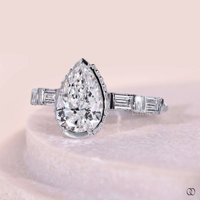 hidden halo engagement ring pear diamond
