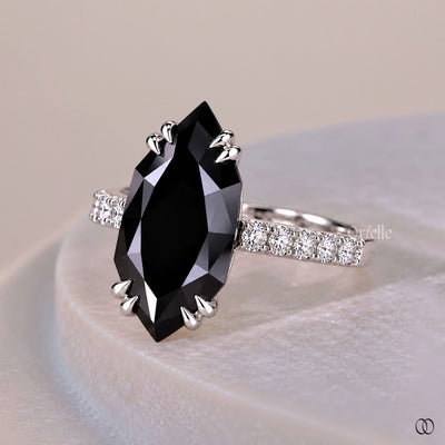 Black moissanite engagement ring with a bold, modern design
