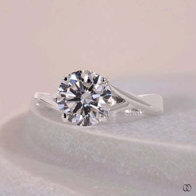 White gold round cut engagement ring with four prong setting
