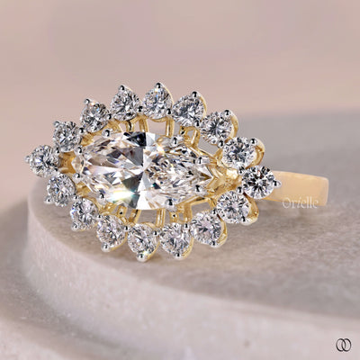 V tip prong marquise diamond yellow gold ring
