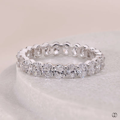 prong setting oval diamond eternity band
