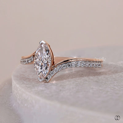 Round side stone ring with a brilliant center diamond and classic setting
