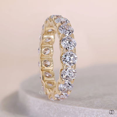 Shared prong wedding band with delicate round diamonds
