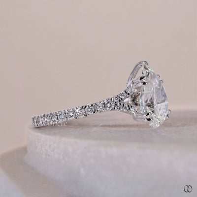 Cathedral style engagement ring with a raised setting and sparkling diamonds
