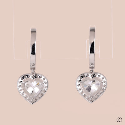 Heart dangle earrings with a sparkling diamond halo setting
