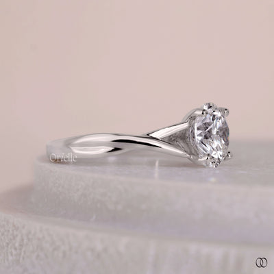Cathedral engagement ring with twisted shank and solitaire diamond
