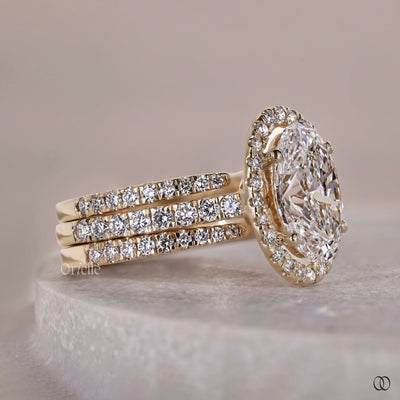 pave diamond ring with oval engagement ring

