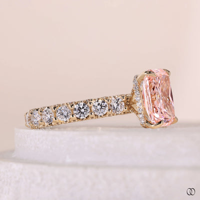 4 prong diamond ring pink center stone
