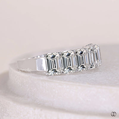 prong set wedding band emerald diamond band
