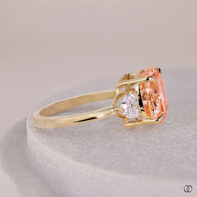 Orange Cushion Cut Ring With Side Trillion Stone