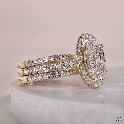 pave diamond ring with oval engagement ring

