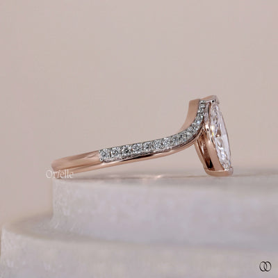V prong ring with a secure marquise diamond setting and elegant details
