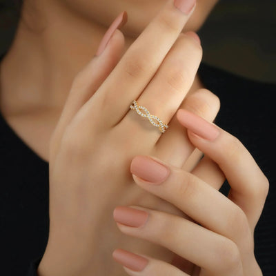 moissanite promise band in white gold twisted infinity design
