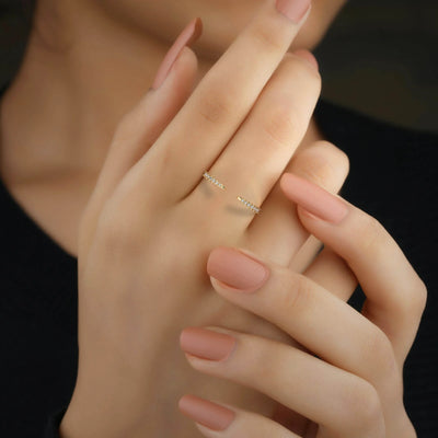 minimalist open gap yellow gold band with moissanite
