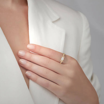 Yellow gold east west marquise ring with delicate prong setting
