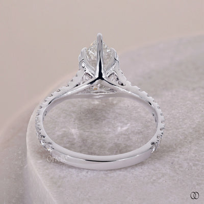 V prong setting ring with a pear shaped diamond and elegant design
