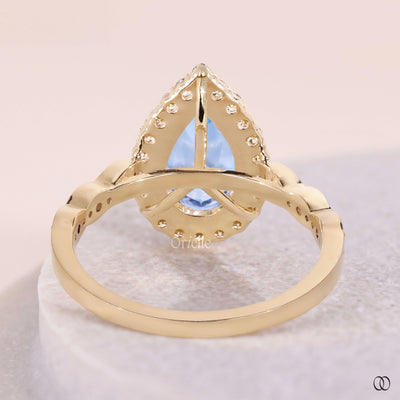 pave set diamond ring blue pear diamond
