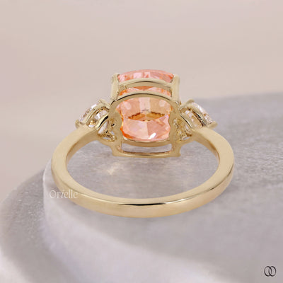 Orange Cushion Cut Ring With Side Trillion Stone