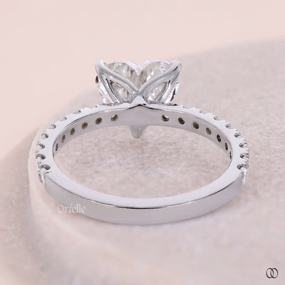Tulip setting engagement ring with elegant diamond details
