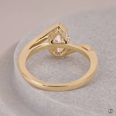 hidden halo engagement ring pear diamond
