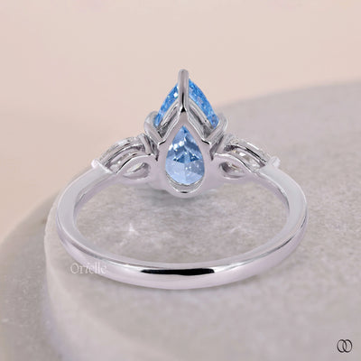 3 pear diamond ring with elegant prong set details
