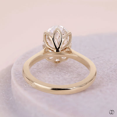 Tulip setting engagement ring with a raised diamond design