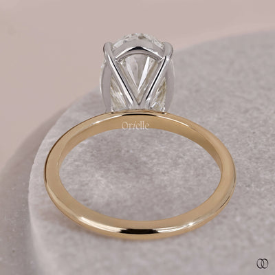 4 prong diamond ring oval solitaire design
