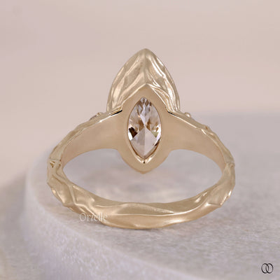 bezel set marquise diamond ring
