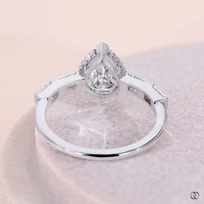 baguette diamond ring pear stone setting
