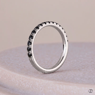 Shared prong setting band with sparkling diamond details
