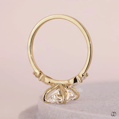 Side stone engagement ring with sparkling accent diamonds
