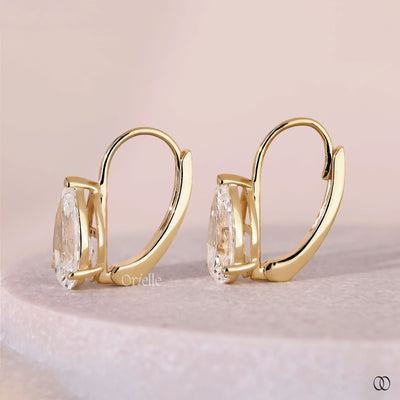 Diamond solitaire drop earrings with pear shaped diamonds
