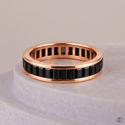 Black diamond wedding band with a bold modern design
