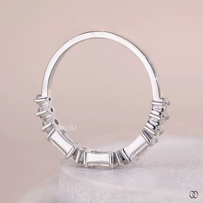 prong set diamond band round emerald stones
