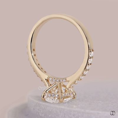 Cathedral style engagement ring with a raised diamond setting

