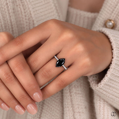 Hidden halo engagement ring with delicate diamond details
