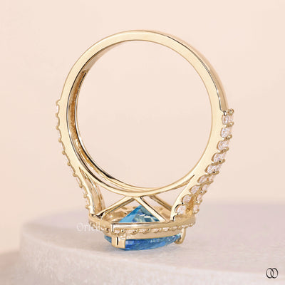 cathedral ring setting blue diamond halo ring
