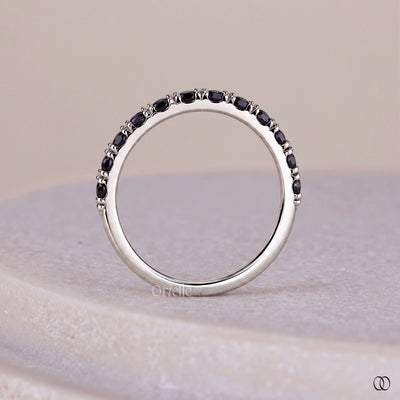 White gold band with elegant diamonds and a polished finish

