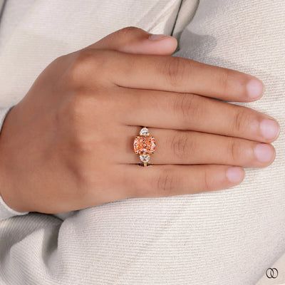 Orange Cushion Cut Ring With Side Trillion Stone