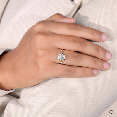 Round and marquise cut side stone engagement ring
