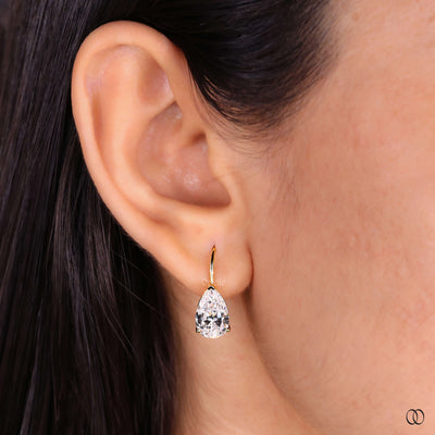 Minimalist diamond earrings with sparkling pear shaped stones
